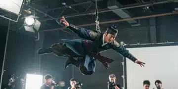 K-Drama actor practicing intense wirework stunt for a 2024 production